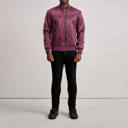 Close-Up Detail of Varsity &amp; Zipper Hardware on Danson Quilted Maroon Varsity Jacket