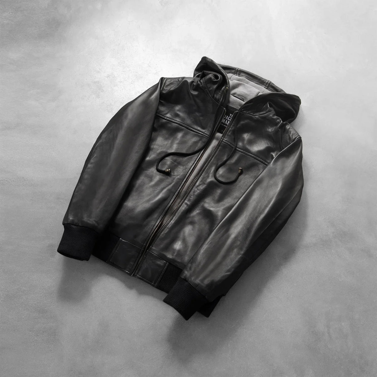 Rib knit &amp; Hem Craftsmanship Construction Detail on Men's Nintenzo Black Hooded Leather Jacket
